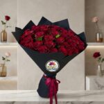 Dark Red Rose Bouquet with Burgundy Ribbon in Black Wrapping by Ideal Fresh Flower