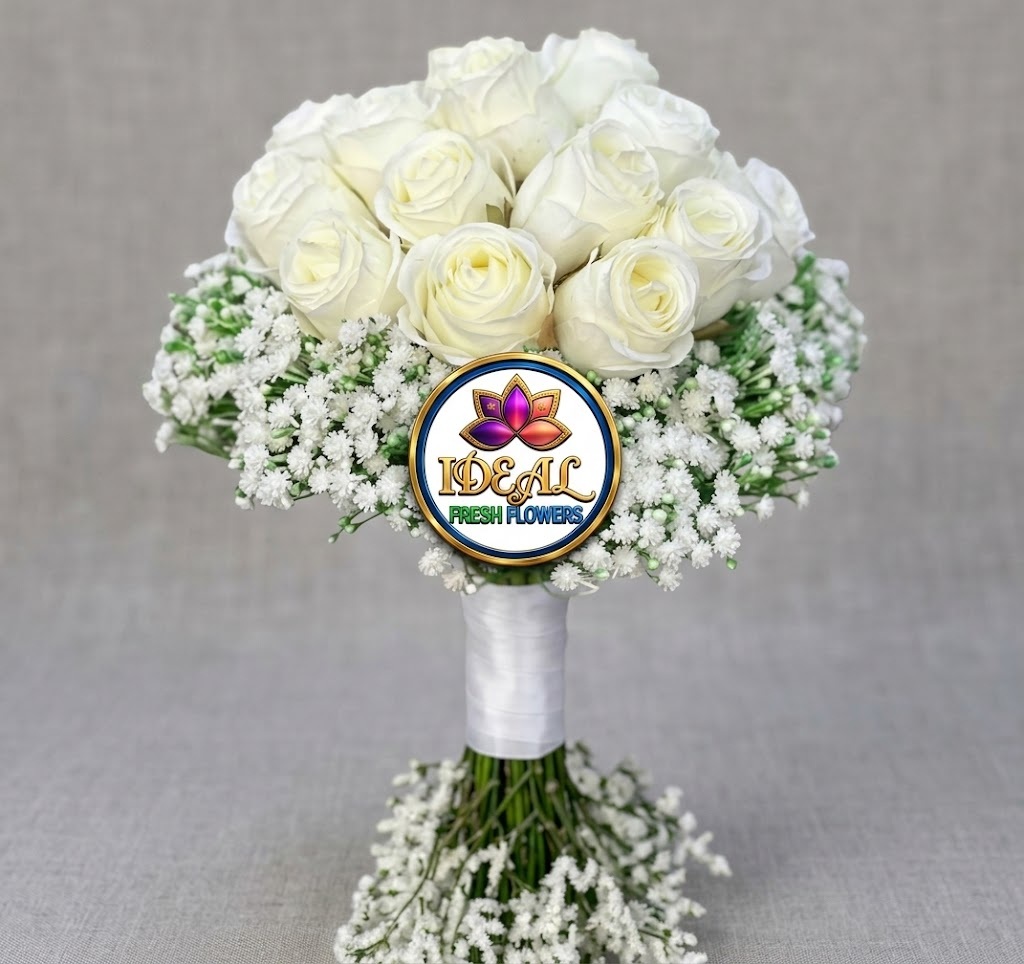 43 White Rose Hand-Tied Bouquet with Baby's Breath by Ideal Fresh Flower - Image 1