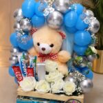Teddy Bear and Balloon Gift Crate with White Roses and Chocolates by Ideal Fresh Flower