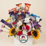 Snack and Flower Gift Basket with Sunflowers and Roses by Ideal Fresh Flower