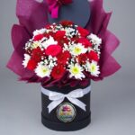 Red and White Flower Hat Box with Burgundy Tissue by Ideal Fresh Flower